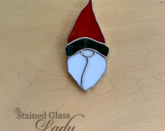 Handcrafted stained glass gnome Christmas ornament in red and green, seasonal home decor, holiday gift tag