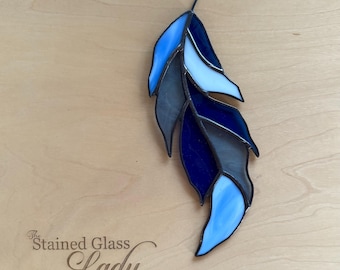 Handcrafted stained glass feather suncatcher in blue and white, whimsical window hanging or home decor