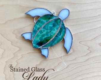 Handcrafted stained glass sea turtle suncatcher in dark green and light green mottled, beachy home decor, coastal gift idea, window hanging