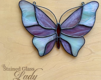 Handcrafted stained glass butterfly suncatcher in irid white and light plum, nature gift idea, whimsical home decor, unique window hanging