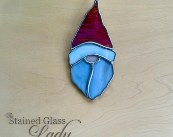 Handcrafted stained glass gnome Christmas ornament in red and white, unique seasonal home decor, holiday gift or stocking tag