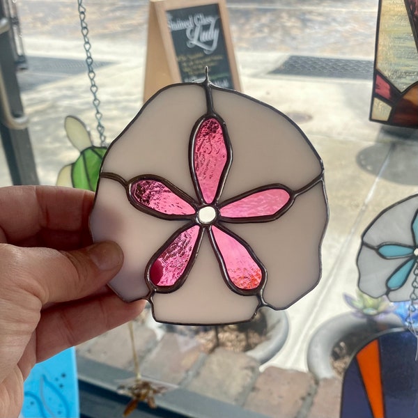 Handcrafted stained glass sand dollar suncatcher in soft pink and cranberry, coastal home decor, beachy window hanging, gift idea