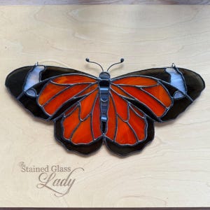 Handcrafted stained glass monarch butterfly in translucent orange wispy, nature home decor, monarch window or wall hanging, gift idea