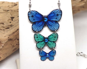 Pendentif papillons de couleur bleue et turquoise