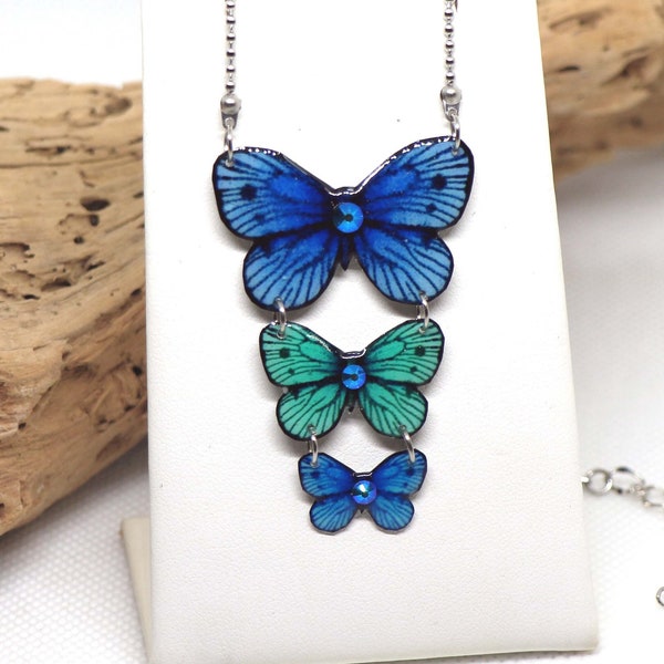 Pendentif papillons de couleur bleue et turquoise