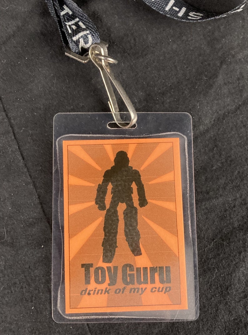 Toy Guru Convention Badge :: Back