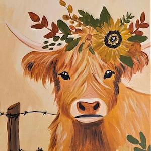 May include: A painting of a shaggy ginger highland cow with a floral crown of yellow sunflowers and autumn-colored leaves. The cow stands beside a wooden fence post with black barbed wire against a light tan background with a small flower below.