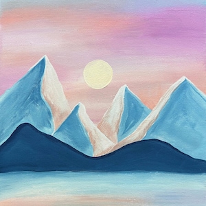 May include: A painting of a landscape featuring sharp, blue-toned mountain peaks against a soft, gradient sky of pink, purple, and orange hues. A pale yellow circular sun sits between the peaks, above a dark blue foreground and a calm, reflective water surface.