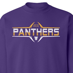 May include: Purple sweatshirt with a white graphic of a football with the text "UNI" and "PANTHERS" in a white and orange striped design.