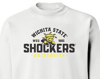 May include: White sweatshirt with the text "Wichita State Shockers" in black and yellow. The design includes a mascot graphic and the words "WSU" and "University". The sweatshirt has a crew neck and long sleeves.