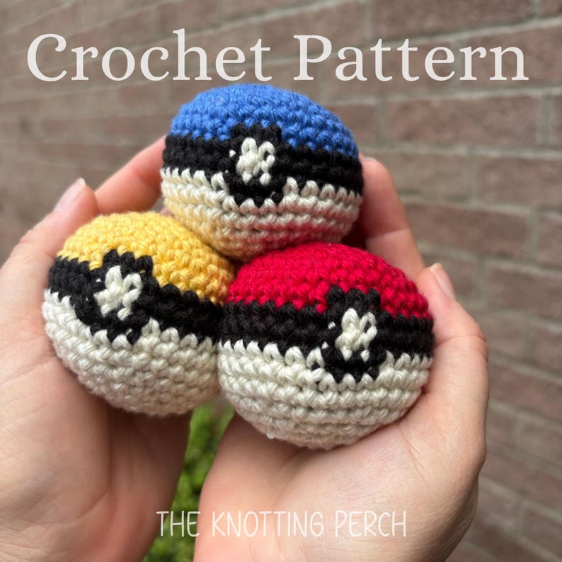 May include: Three spherical crochet items featuring a color-blocked design with a blue, yellow, or red top half, a white bottom half, and a black horizontal band with a central white circular detail. The text Crochet Pattern and THE KNOTTING PERCH appear.