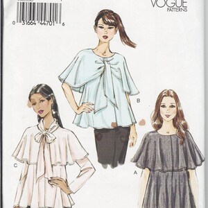 May include: A sewing pattern for a women's blouse with a cape collar. The pattern includes three different styles: a light blue blouse with a bow, a pink blouse with a bow, and a gray blouse with a bow. The pattern is for sizes 6-8-10-12-14.