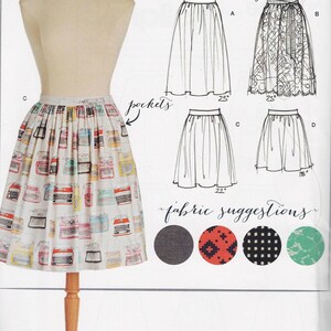May include: A sewing pattern for a skirt with four different styles. The pattern includes fabric suggestions and a skill level rating of easy. The pattern number is 8211 and the size is 14-22.