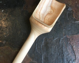 Hand carved wooden scoop.