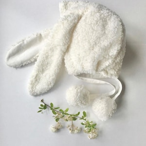 Handmade white super soft  Sherpa Easter bunny bonnet with pom poms.