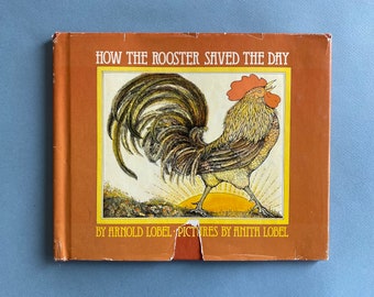 Signed How the Rooster Saved the Day by Arnold Lobel ~ A thief tries to insure perpetual darkness for his activities by murdering a rooster