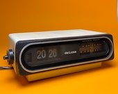 Cool flip clock alarm radio made in Germany 1970s.