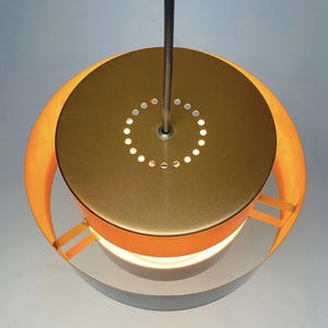Close up of top of Classic danish Juno copper ceiling light by Jo Hammerborg for Fog and Morup, Denmark 1966.