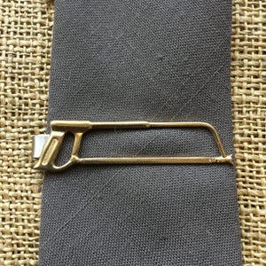 1940’s Spartan hack saw tie bar | 2 3/4” long | Gold toned | nice vintage condition