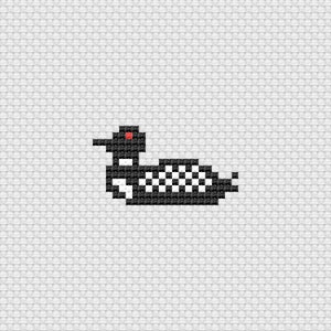 May include: Pixelated cross-stitch design of a loon, rendered in black and white with a red eye. The bird is depicted in a side profile, with a checkered pattern on its body. The background is a light gray, textured fabric.