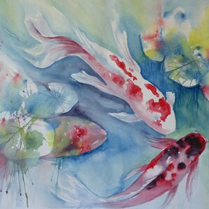 May include: Watercolor painting of three koi fish swimming in a pond with lily pads. The fish are red, white, and black with splashes of blue and green paint.