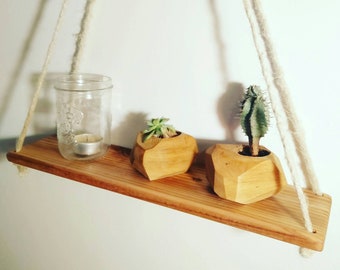 Hanging shelf. Reclaimed wood shelf hanging on natural rope. Scrapwood shelving. rustic look wall decoration