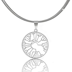 May include: A silver necklace with a circular pendant featuring a tree of life design. The pendant is made of metal and has a delicate, intricate pattern.