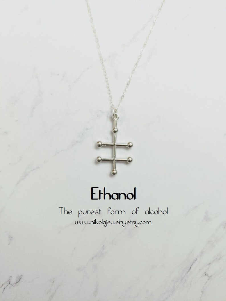 May include: Silver necklace with a pendant shaped like the chemical structure of ethanol. The pendant is made of small silver balls connected by thin silver bars. The text "Ethanol" and "The purest form of alcohol" is printed below the pendant.