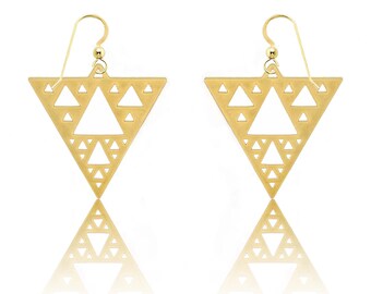 May include: Gold triangle earrings with a geometric pattern of smaller triangles. The earrings are made of a solid metal and have a shiny finish.