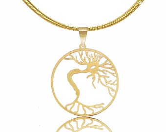 May include: A gold necklace with a circular pendant featuring a delicate tree of life design. The pendant is cut out, creating a negative space effect.