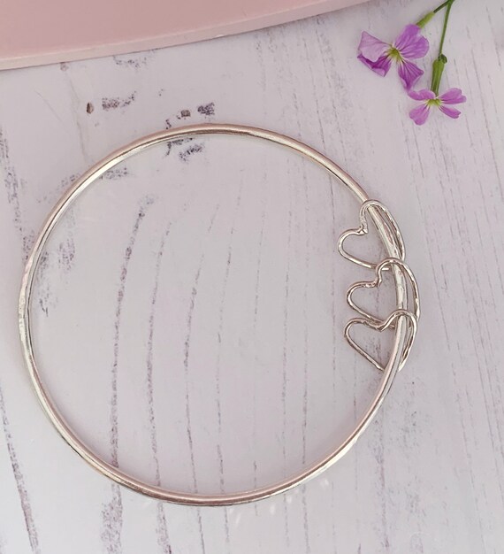 Recycled sterling silver bangle with 3 heart charms. 2.5mm thick hammered bangle, valentines.