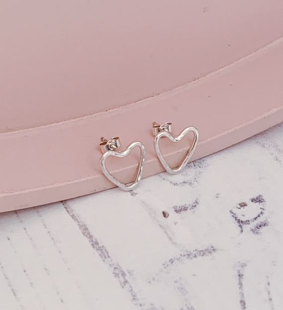 Minimal style sterling silver heart outline stud earrings. Hammered texture, recycled eco silver. Unique one of a kind.