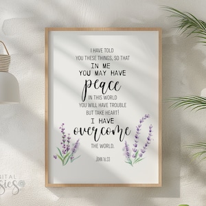 May include: A white printable art print with a quote from John 16:33, "I have told you these things, so that in me you may have peace. In this world you will have trouble but take heart! I have overcome the world." The quote is surrounded by watercolor lavender flowers.