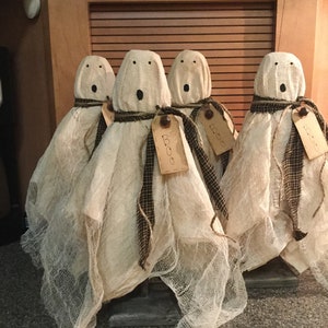 Primitive ghost on wooden stand