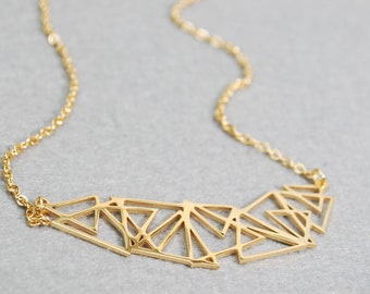 Stainless steel geometric abstract necklace, suitable for both casual and formal occasions. Makes a great gift idea.