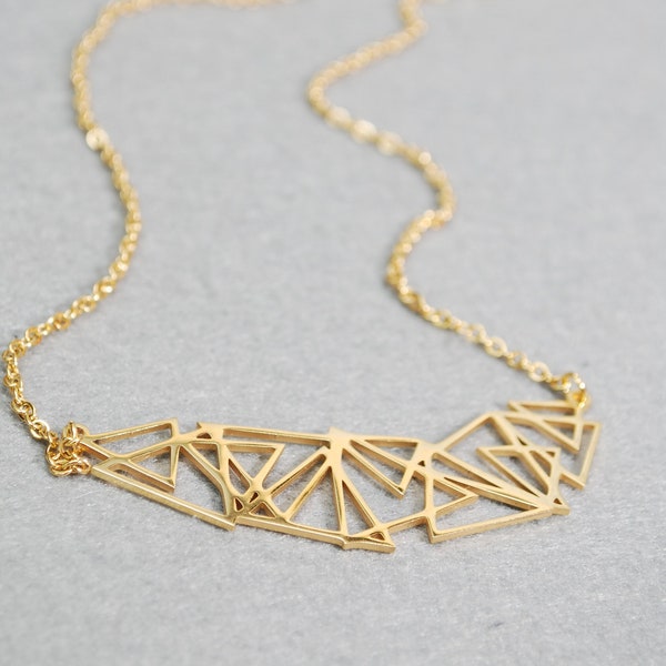 Stainless steel geometric abstract necklace, suitable for both casual and formal occasions. Makes a great gift idea.