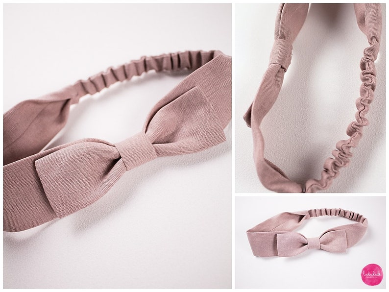 May include: A dusty rose fabric headband with a bow. The headband is elastic and has a simple design.