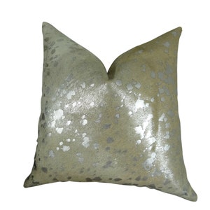 May include: A square throw pillow with a light beige background and silver metallic spots. The pillow is made of a soft, textured fabric.