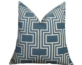 May include: A blue and white geometric patterned throw pillow. The pillow has a square shape and a white background with a blue geometric pattern.