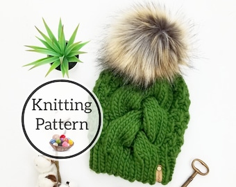 May include: Knitting pattern for a green beanie with a brown and white faux fur pom pom. The pattern is titled "Knitting Pattern" and includes a basket of yarn.