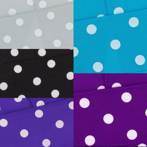 May include: Four different colours of ribbon with white polka dots. The colours are light grey, turquoise, black, and purple.