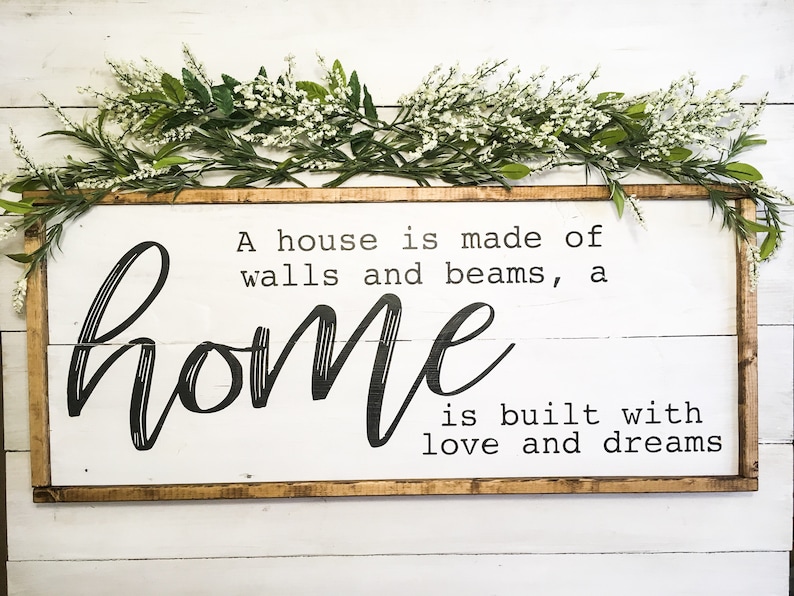 A House is made of bricks and beams A Home is made of love and dreams wood sign