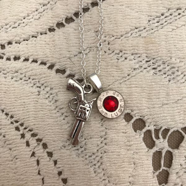 Pistol charm necklace with bullet casing