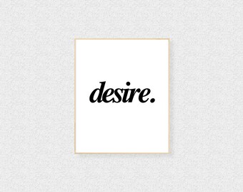 May include: A white framed print with the word "desire" in black, stylized font.