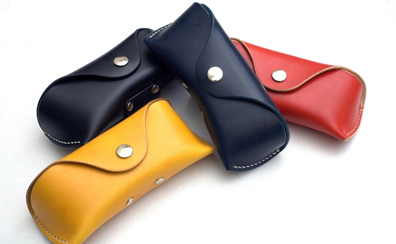 Yellow, red, black, blue leather eyeglasses case made by Celyfos