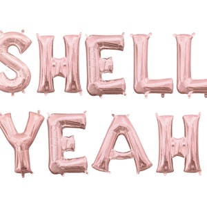 Może przedstawiać: Balony z folii w kolorze różowego złota, tworzące napis "Shell Yeah!"