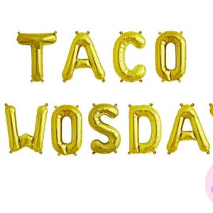 May include: Gold foil letter balloons spelling out "Taco Twosday". The balloons are self-inflating and do not require helium.
