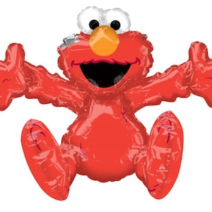 May include: A red Elmo-shaped balloon with outstretched arms and legs. The balloon has a white and silver head, orange nose, and a large open mouth. The balloon is designed to look like the Sesame Street character Elmo.