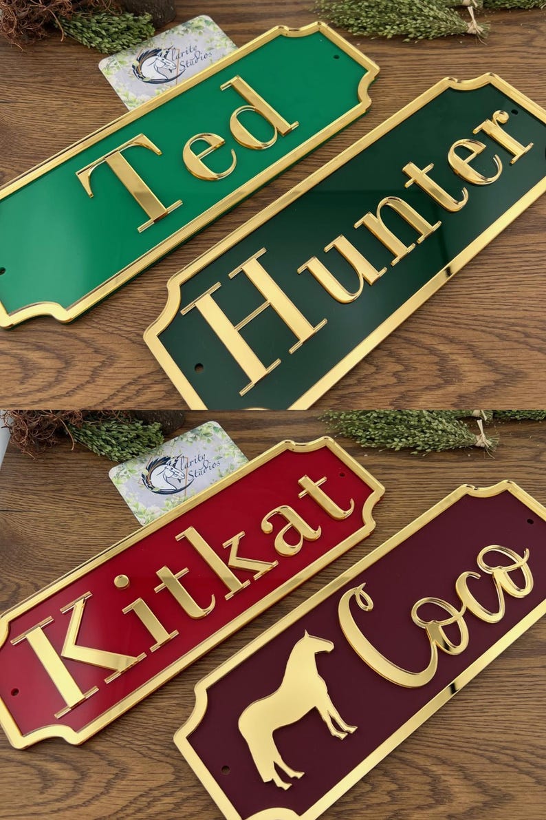 May include: Rectangular name signs in green, dark green, red, and burgundy with gold lettering. The names "Ted", "Hunter", "Kitkat", and "Coco" are displayed. The "Coco" sign features a gold horse silhouette.