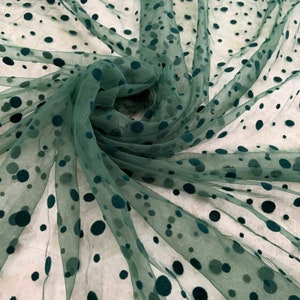 Dark green tulle fabric with velvet polka dots